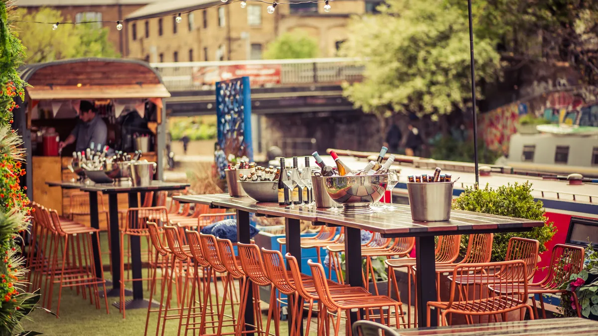 Outdoor dining space next to a river