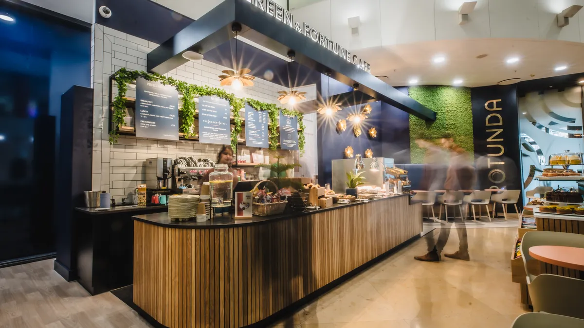 Professional team members collaborating in Green & Fortune cafe