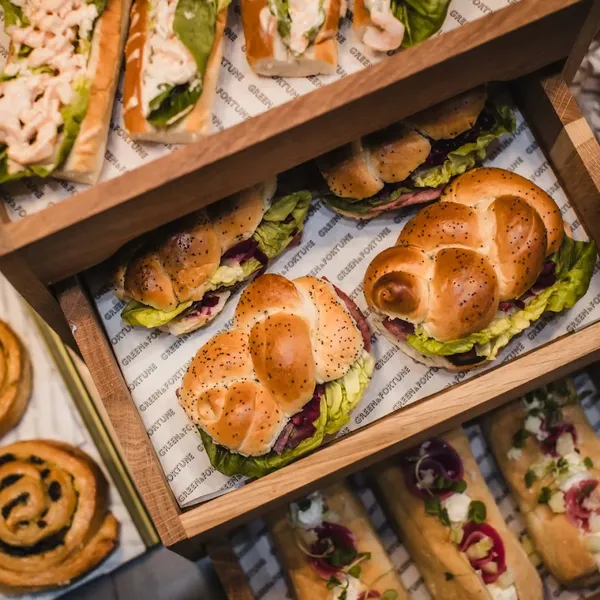 Sandwiches and pastries carefully arranged